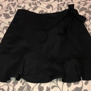 Black ruffle mini skirt
